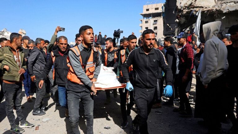 gaza-police-station-airstrike-body-carried.jpg