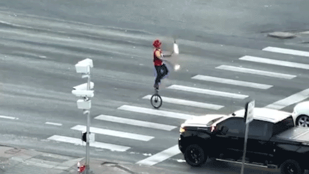 fire-juggeler-on-unicycle.gif