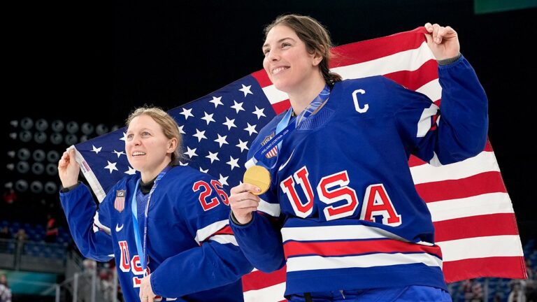hilary-knight-kendall-coyne-with-flag.jpg