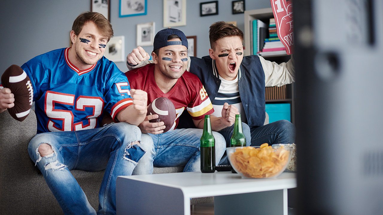 men-watching-football-eating-chips.jpg