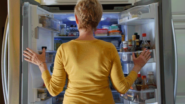 woman-looking-in-fridge-food-cravings.gif