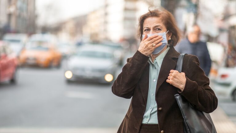 woman-on-city-street-mask-pollution.jpg