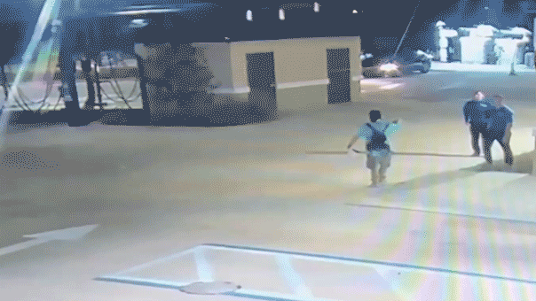 man-with-ax-tackled-at-car-wash.gif