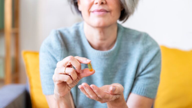 woman-holding-omega3-capsule.jpg