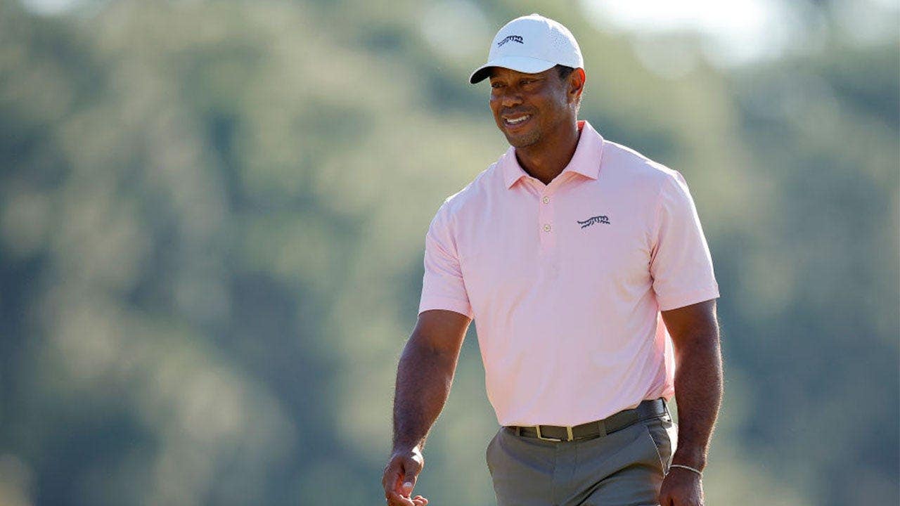 tiger-woods-smiling-golf.jpeg
