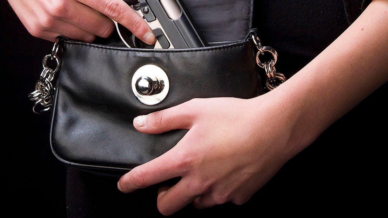woman-holding-handgun-purse-fox-news-001.jpeg