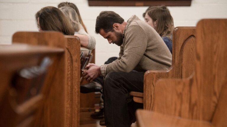 Man-in-church-praying-Getty-1-e1668010785270.jpg