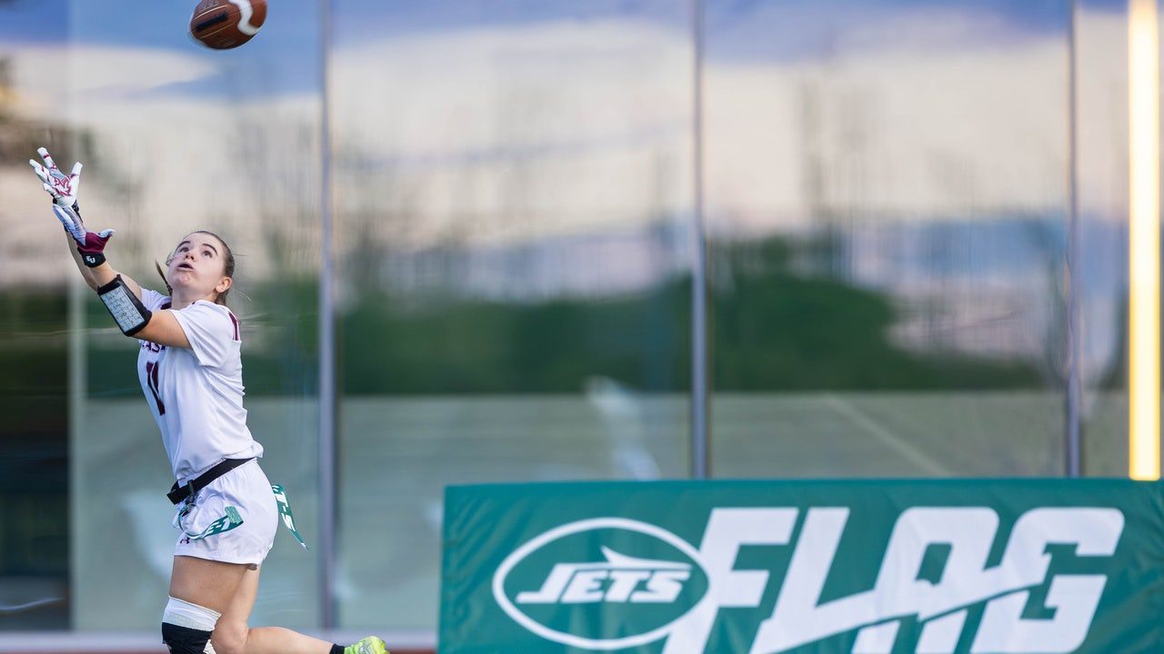 girl-reaches-catch-football-jets.jpg