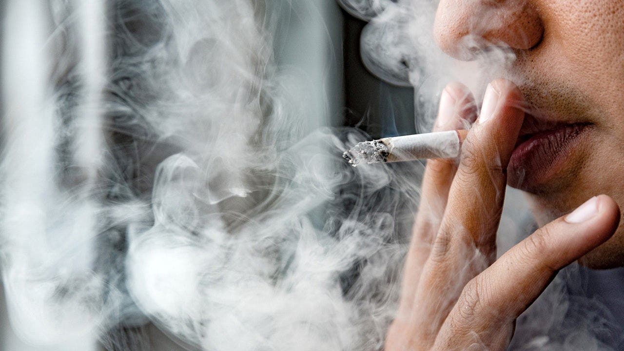 man_smoking_cigarette-1154734877.jpeg