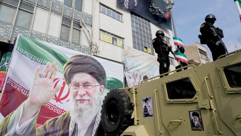 policemen-supreme-leader-banner-tehran.jpg