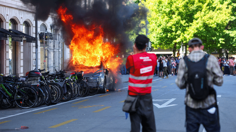 un-offices-smashed-tesla-fire-protest.png