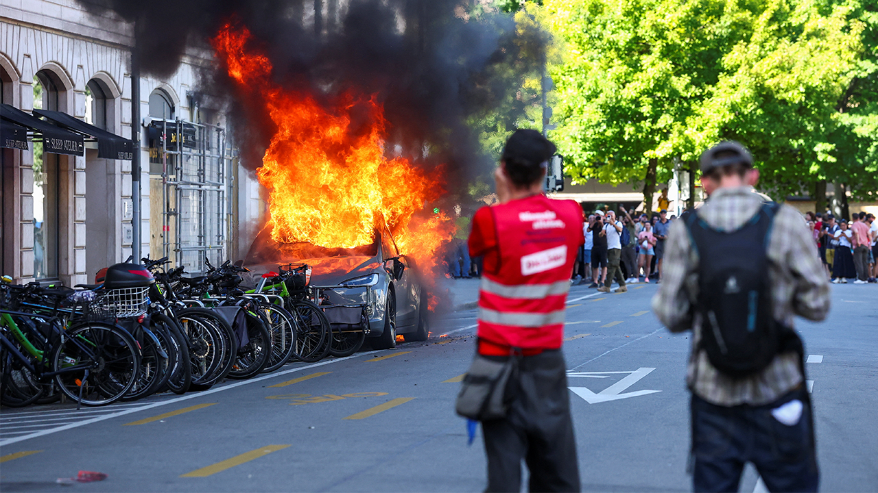 un-offices-smashed-tesla-fire-protest.png