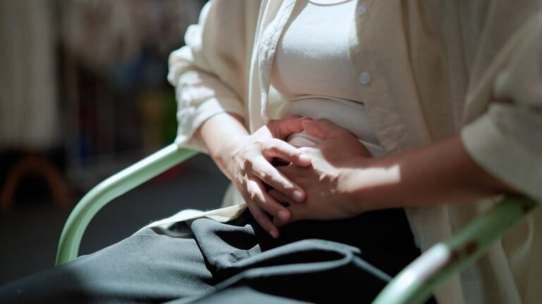 woman-holding-midsection.jpg