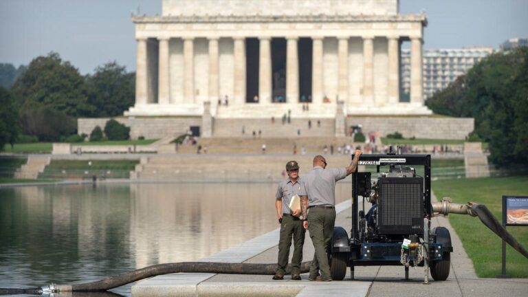 Crews-draining-reflecting-pool.jpg