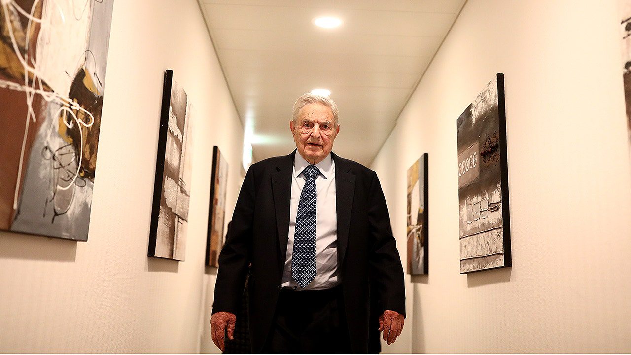 george-soros-walking-hallway.jpg