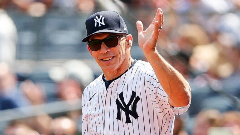 joe-girardi-salutes-yankee-stadium-old-timers-day.jpg