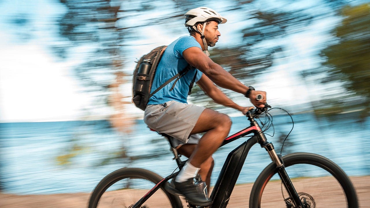 man-electric-mountain-bike-seaside.jpg