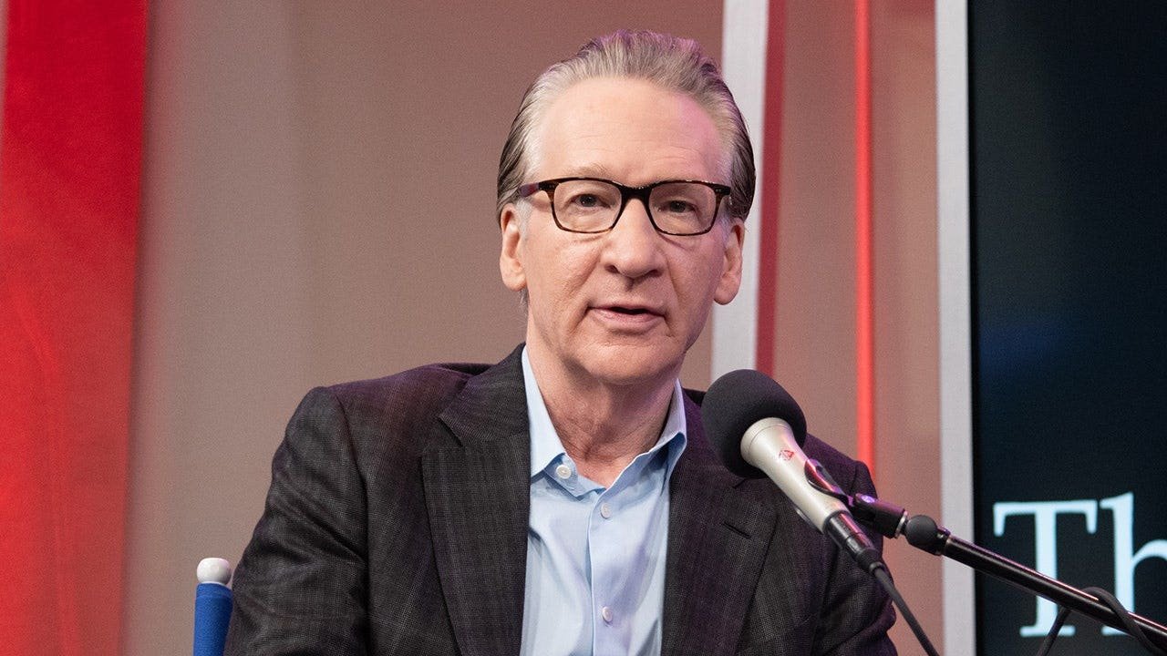 bill-maher-speaking-microphone.jpg