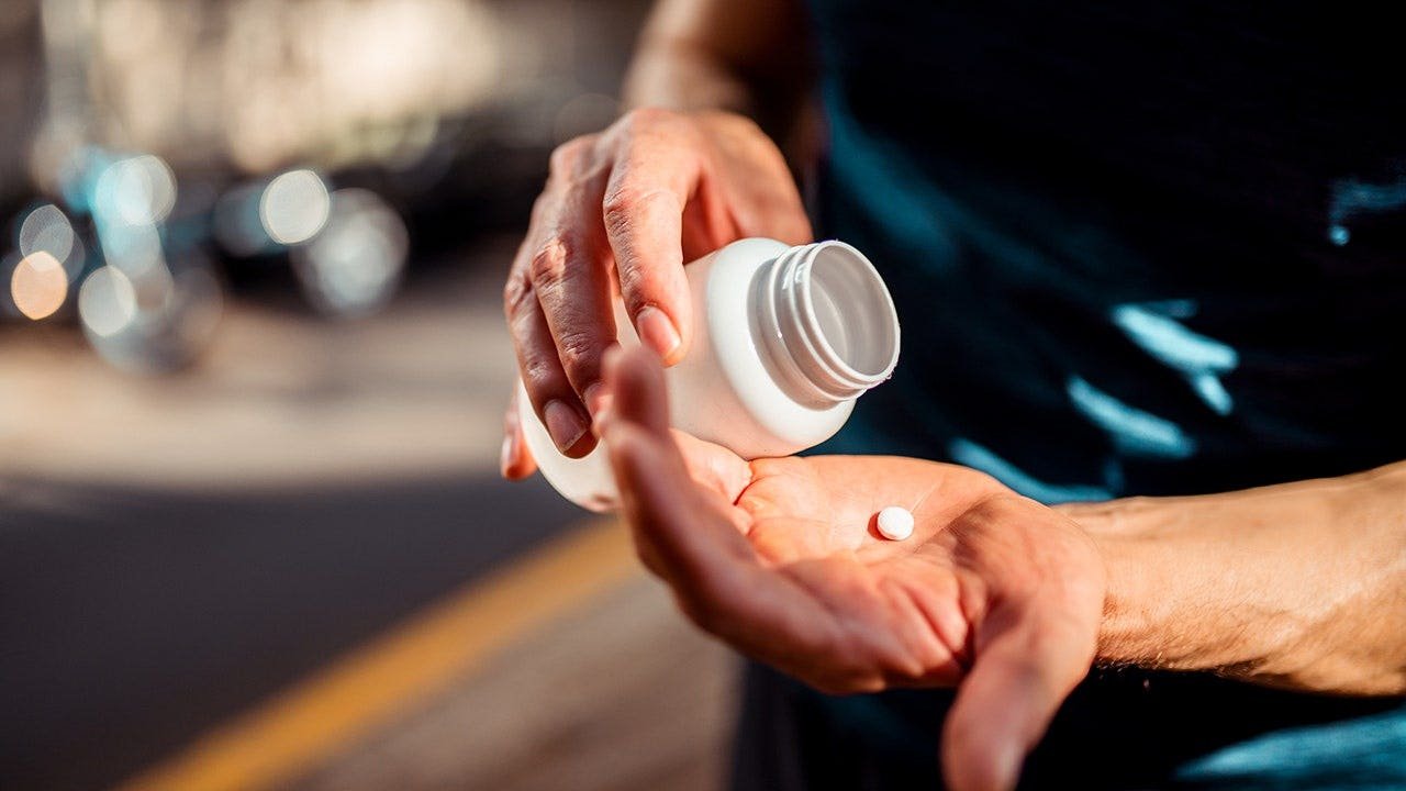 hands-medicine-bottle-pill.jpg
