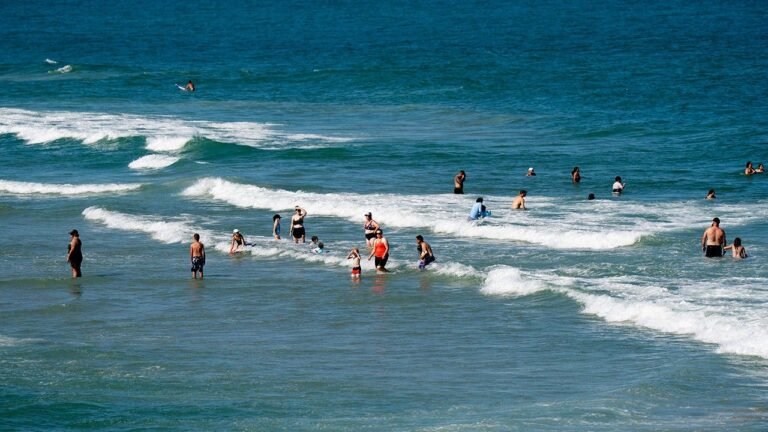 people-cool-off-ocean-kure-beach-north-carolina.jpg
