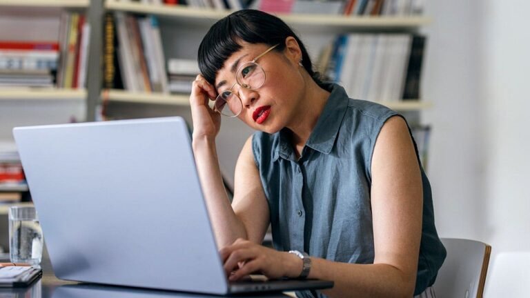 Serious-woman-works-on-laptop-computer.jpg