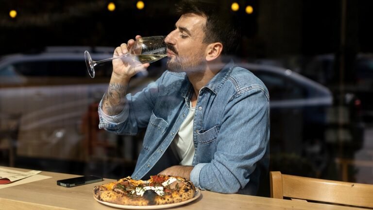 man-solo-dining-persona-pizza-wine.jpg