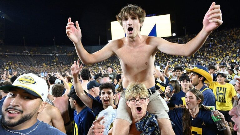michigan-fans-storm-field-hail-mary.jpg