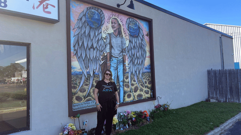 nichole-schmidt-next-to-gabby-petito-mural-in-blue-point-ny.png