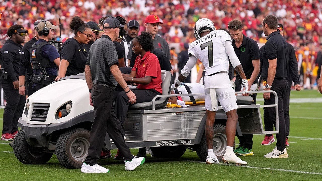 evan-stewart-dante-moore-carted-off.jpg