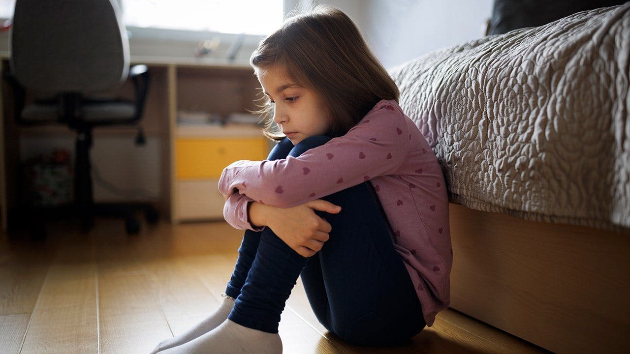 little-girl-sitting-alone.jpeg