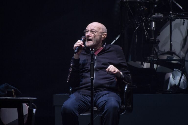 phil-collins-genesis-performing-nanterre-scaled.jpg