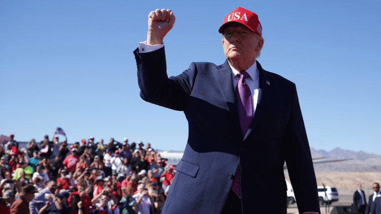 trump-raises-fist-arizona-midterm-rally.png